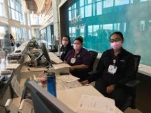 Patient Registration, guest services wearing pink masks